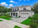 Charming two-story home with a manicured lawn, a paved driveway, and a beautiful front door and shutters at 809 Maxwell St, Orlando, FL 32804