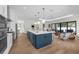 Modern open-concept kitchen with a large island, stainless steel appliances, and hardwood floors at 809 Maxwell St, Orlando, FL 32804