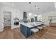 Bright kitchen featuring a large island, stainless steel appliances, and a view into the pantry at 809 Maxwell St, Orlando, FL 32804