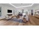 Open-concept living room showcasing a modern fireplace, sleek furniture, and an inviting atmosphere at 809 Maxwell St, Orlando, FL 32804
