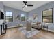 A modern living area features stylish decor, hardwood floors, and large windows offering ample light at 809 Maxwell St, Orlando, FL 32804