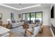 Bright and airy living room featuring a modern fireplace and sliding doors to the outdoor patio at 809 Maxwell St, Orlando, FL 32804