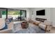 Beautiful living room featuring modern fireplace, chairs and sliding doors to the outdoor patio at 809 Maxwell St, Orlando, FL 32804