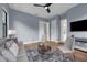 The light-filled living area is furnished with modern seating, complemented by stylish decor and large windows at 809 Maxwell St, Orlando, FL 32804