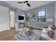 A cozy living area is furnished with modern seating and large windows for natural lighting and style at 809 Maxwell St, Orlando, FL 32804