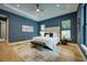 Spacious main bedroom with tray ceilings, large windows, and stylish furnishings for a luxurious retreat at 809 Maxwell St, Orlando, FL 32804
