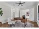 Bright office with hardwood floors, a rustic wooden desk, and a comfortable white chair at 809 Maxwell St, Orlando, FL 32804