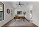 Bright office with hardwood floors, a rustic wooden desk, and a view of the bathroom at 809 Maxwell St, Orlando, FL 32804