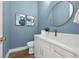 Stylish powder room with a floating vanity and a modern mirror at 809 Maxwell St, Orlando, FL 32804