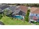 Aerial view showcasing a home with a screened-in pool at 8118 Yellow Crane Dr, Kissimmee, FL 34747