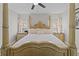 Main bedroom with a large four poster bed and nightstands at 8118 Yellow Crane Dr, Kissimmee, FL 34747