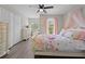 Bedroom with floral bedding and a ceiling fan at 8118 Yellow Crane Dr, Kissimmee, FL 34747