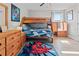 bedroom with bunk beds, wood dresser, and Spiderman rug at 8118 Yellow Crane Dr, Kissimmee, FL 34747