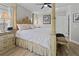 Main bedroom with large bed, nightstands, and ensuite access at 8118 Yellow Crane Dr, Kissimmee, FL 34747