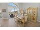 Elegant dining room with a large table and hutch, offers view to the pool at 8118 Yellow Crane Dr, Kissimmee, FL 34747