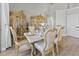 Formal dining room with a table for six and two display cabinets at 8118 Yellow Crane Dr, Kissimmee, FL 34747