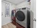 Laundry room with washer, dryer, and ample storage at 8118 Yellow Crane Dr, Kissimmee, FL 34747