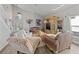 Living room with leather and fabric sofas, and a large entertainment center at 8118 Yellow Crane Dr, Kissimmee, FL 34747