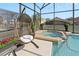 Spa and hanging chair next to the pool at 8118 Yellow Crane Dr, Kissimmee, FL 34747