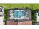 Enclosed pool with patio furniture and a screened enclosure at 8118 Yellow Crane Dr, Kissimmee, FL 34747