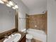 Second bathroom with shower/tub combo and vanity at 914 Charo Pkwy # 112, Davenport, FL 33897