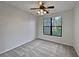 Well-lit bedroom with carpet and ceiling fan at 914 Charo Pkwy # 112, Davenport, FL 33897