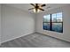 Bright bedroom featuring large windows and neutral carpeting at 914 Charo Pkwy # 112, Davenport, FL 33897