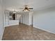 Open living room showcasing tile flooring and neutral wall colors at 914 Charo Pkwy # 112, Davenport, FL 33897