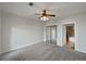 Main bedroom with carpet, ceiling fan and ensuite bathroom at 914 Charo Pkwy # 112, Davenport, FL 33897