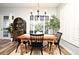 Bright dining room with a farmhouse table and chairs, complemented by natural light at 1254 Chessington Cir, Lake Mary, FL 32746