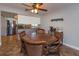 Casual dining area with a circular table and leather chairs next to kitchen at 1354 Tierra Cir, Winter Park, FL 32792