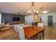 Open dining area with a wooden table and view into the living room at 1354 Tierra Cir, Winter Park, FL 32792