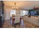 Dining area with wooden table and access to the living room at 1354 Tierra Cir, Winter Park, FL 32792