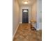Home entryway with dark gray door and terracotta tile floor at 1354 Tierra Cir, Winter Park, FL 32792