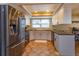 Updated kitchen, featuring stainless steel appliances and light-grey cabinets at 1354 Tierra Cir, Winter Park, FL 32792