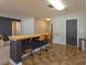 Modern kitchen with stainless steel appliances and granite countertops at 1354 Tierra Cir, Winter Park, FL 32792