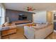 Living room with hardwood floors, a large TV, and comfortable seating at 1354 Tierra Cir, Winter Park, FL 32792