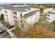 Aerial view of condo community, showcasing building and surrounding area at 1368 Centre Court Ridge Dr # 104, Reunion, FL 34747