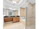 Spa-like bathroom with double vanity and large shower at 1368 Centre Court Ridge Dr # 104, Reunion, FL 34747