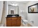 Clean bathroom with granite vanity, updated fixtures, and a mirrored medicine cabinet at 1368 Centre Court Ridge Dr # 104, Reunion, FL 34747