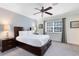 Comfortable bedroom with a queen-size bed and large window at 1368 Centre Court Ridge Dr # 104, Reunion, FL 34747