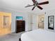 Main bedroom with king bed, en-suite bathroom, and plenty of natural light at 1368 Centre Court Ridge Dr # 104, Reunion, FL 34747