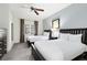 Guest bedroom with two twin beds, ceiling fan, and ample closet space at 1368 Centre Court Ridge Dr # 104, Reunion, FL 34747