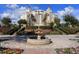 Luxury resort-style building with fountain and landscaping at 1368 Centre Court Ridge Dr # 104, Reunion, FL 34747