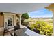 Relaxing patio with golf course view and seating for outdoor dining at 1368 Centre Court Ridge Dr # 104, Reunion, FL 34747