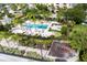 Resort-style pool with playground and surrounding landscaping at 1368 Centre Court Ridge Dr # 104, Reunion, FL 34747