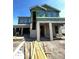 Two-story home under construction with visible framework and a modern design at 1417 Miller Ave, Winter Park, FL 32789