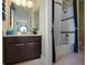 Bathroom with vanity, tub and shower, and decorative plants at 14442 Avenue Of The Rushes, Winter Garden, FL 34787