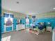 Themed bedroom with a fun aquatic mural and plenty of storage at 14442 Avenue Of The Rushes, Winter Garden, FL 34787