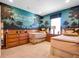 Bedroom with twin beds, nature-themed wall, and ample storage at 14442 Avenue Of The Rushes, Winter Garden, FL 34787